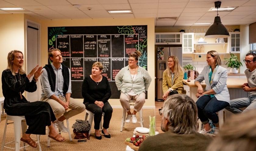 James and Laurentine with a group of people